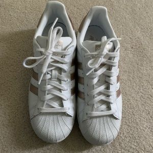 Adidas superstar with rose gold stripe